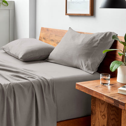 Bed with microfiber bedding and pillows in a bedroom setting