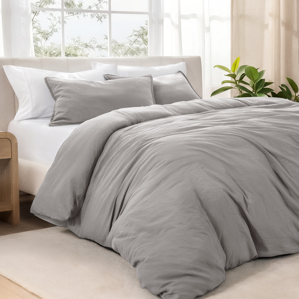 Bedding set on a bed in a bright room with natural light