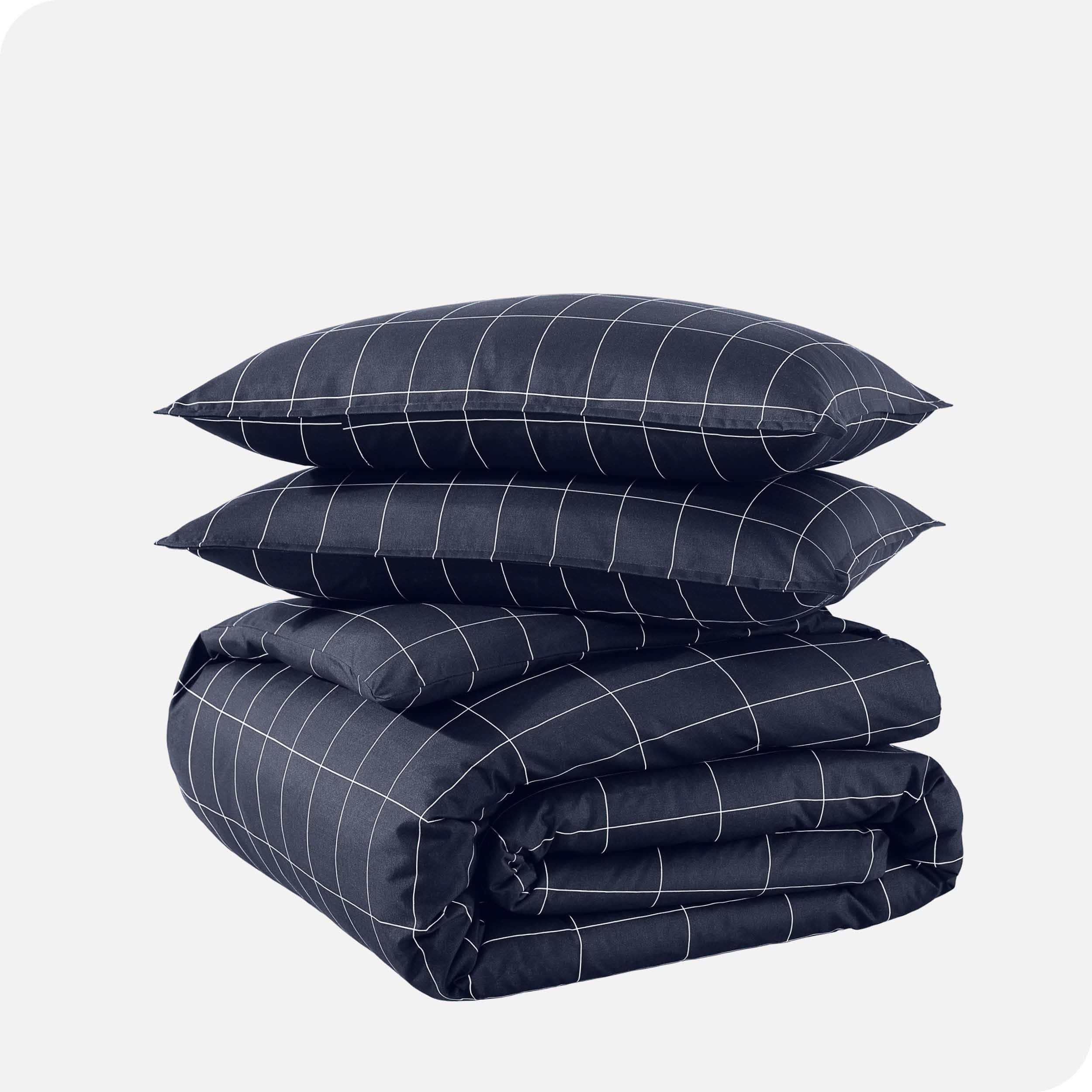 A duvet cover set folded and stacked