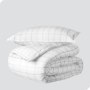 A duvet cover set folded and stacked