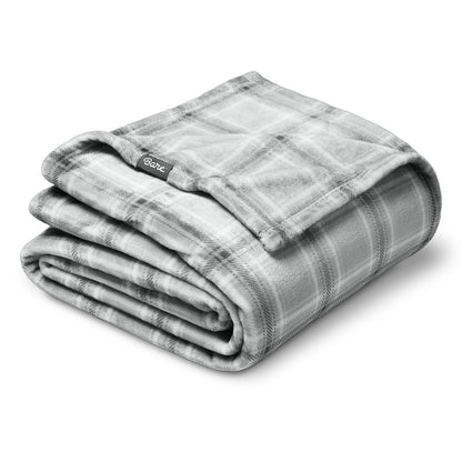 Folded gray plaid blanket with a Bare tag on a white background