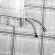 Close-up of a plaid fabric with corner ties