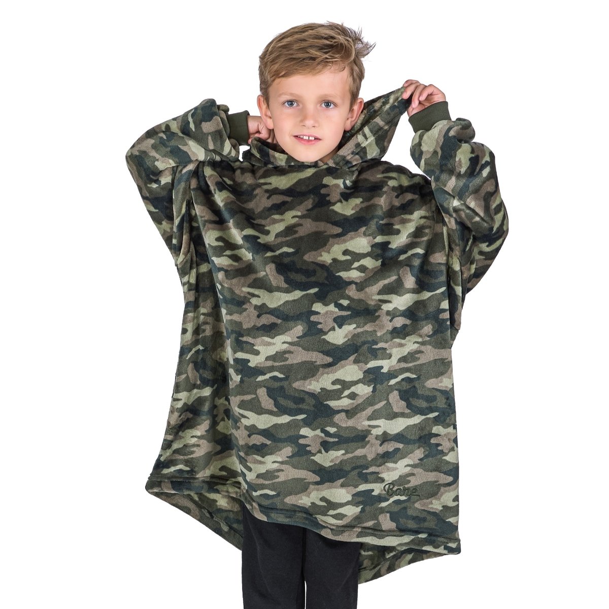 A boy dressed in a microplush wearable blanket.