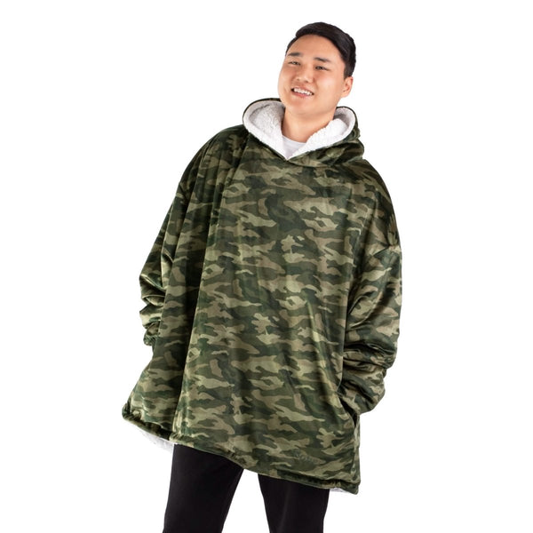 An adult with a sherpa wearable blanket on