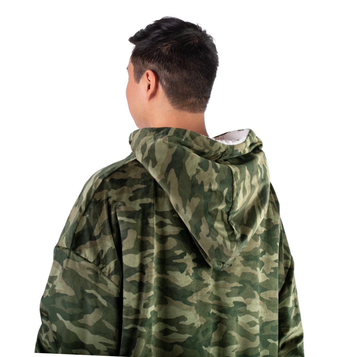 Person wearing a hooded blanket on a white background