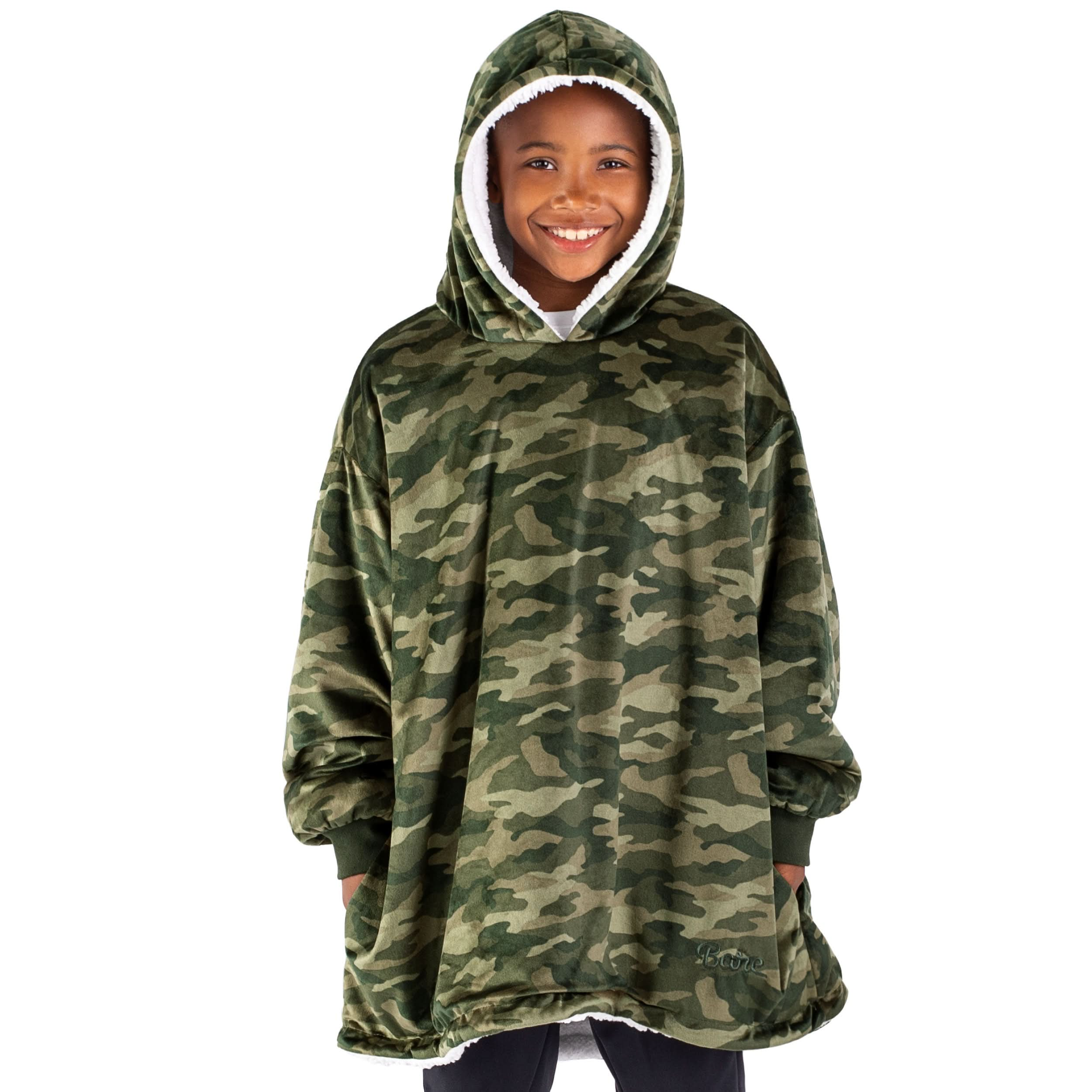 A boy with a hooded wearable blanket on