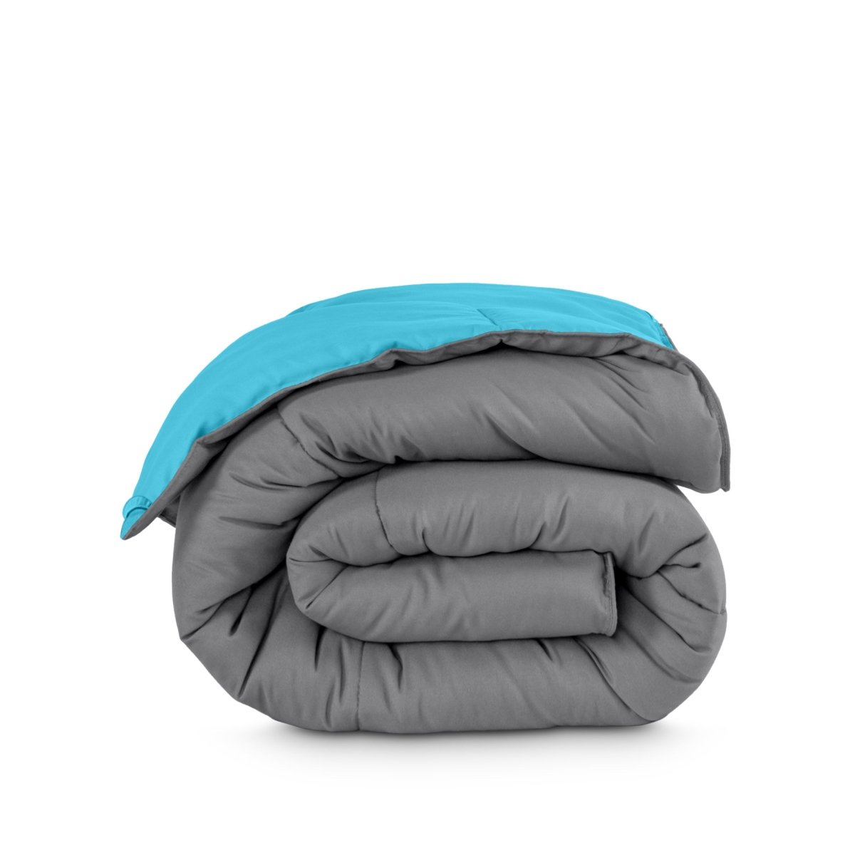 Folded reversible comforter on a white background