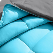 Close up of the comforter folded back showing the two different colored sides