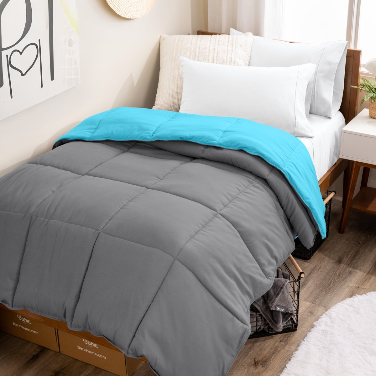 College dorm room with a reversible comforter on the bed