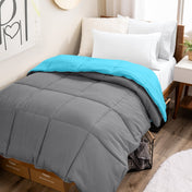 College dorm room with a reversible comforter on the bed