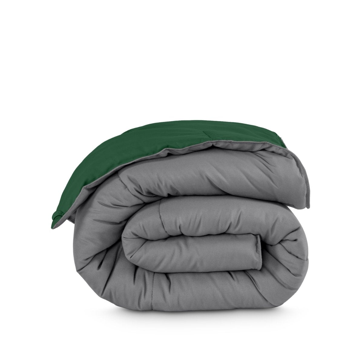 Folded reversible comforter on a white background