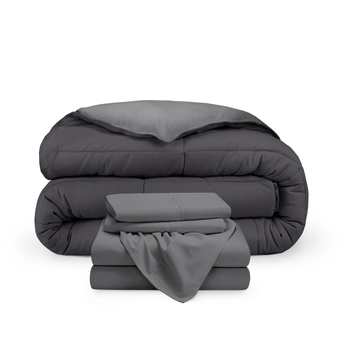 A reversible microfiber comforter and a coordinating sheet set folded and stacked
