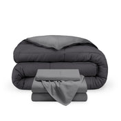 A reversible microfiber comforter and a coordinating sheet set folded and stacked