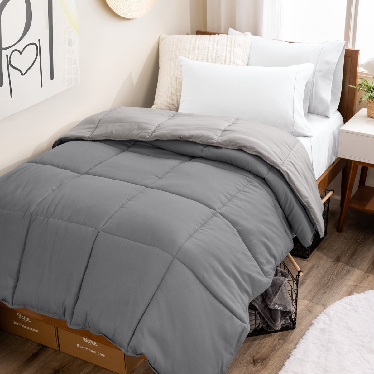 College dorm room with a reversible comforter on the bed