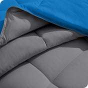 Close up of the comforter folded back showing the two different colored sides