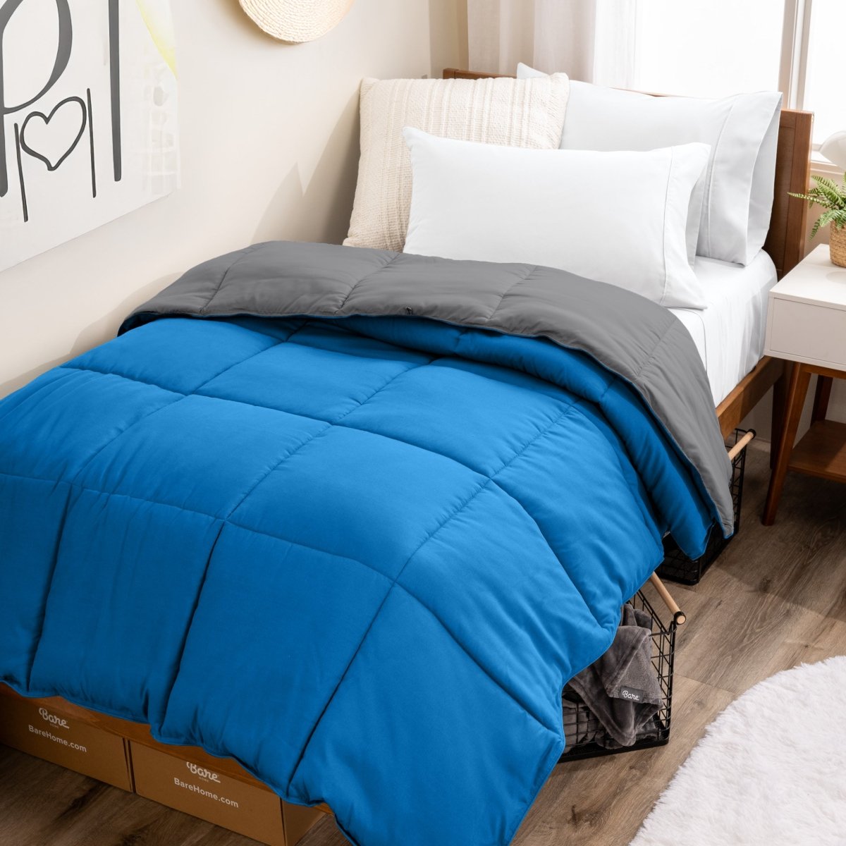 College dorm room with a reversible comforter on the bed