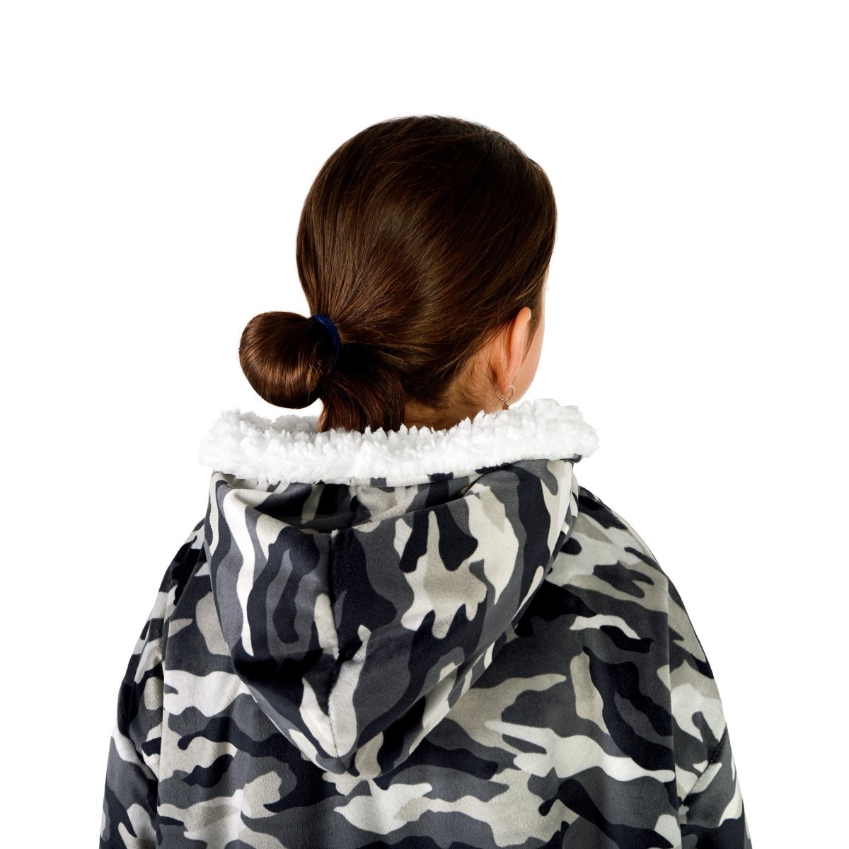 A child with a sherpa wearable blanket on