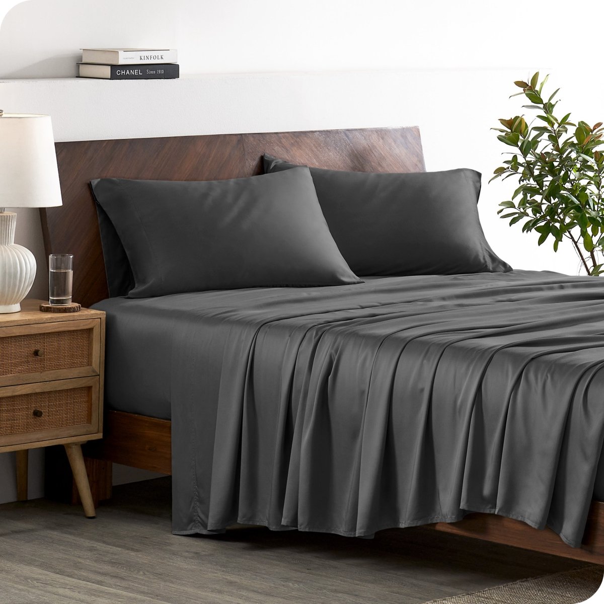 A stylish bed with bamboo sheets and pillowcases, showcasing a sophisticated and elegant bedroom setting.