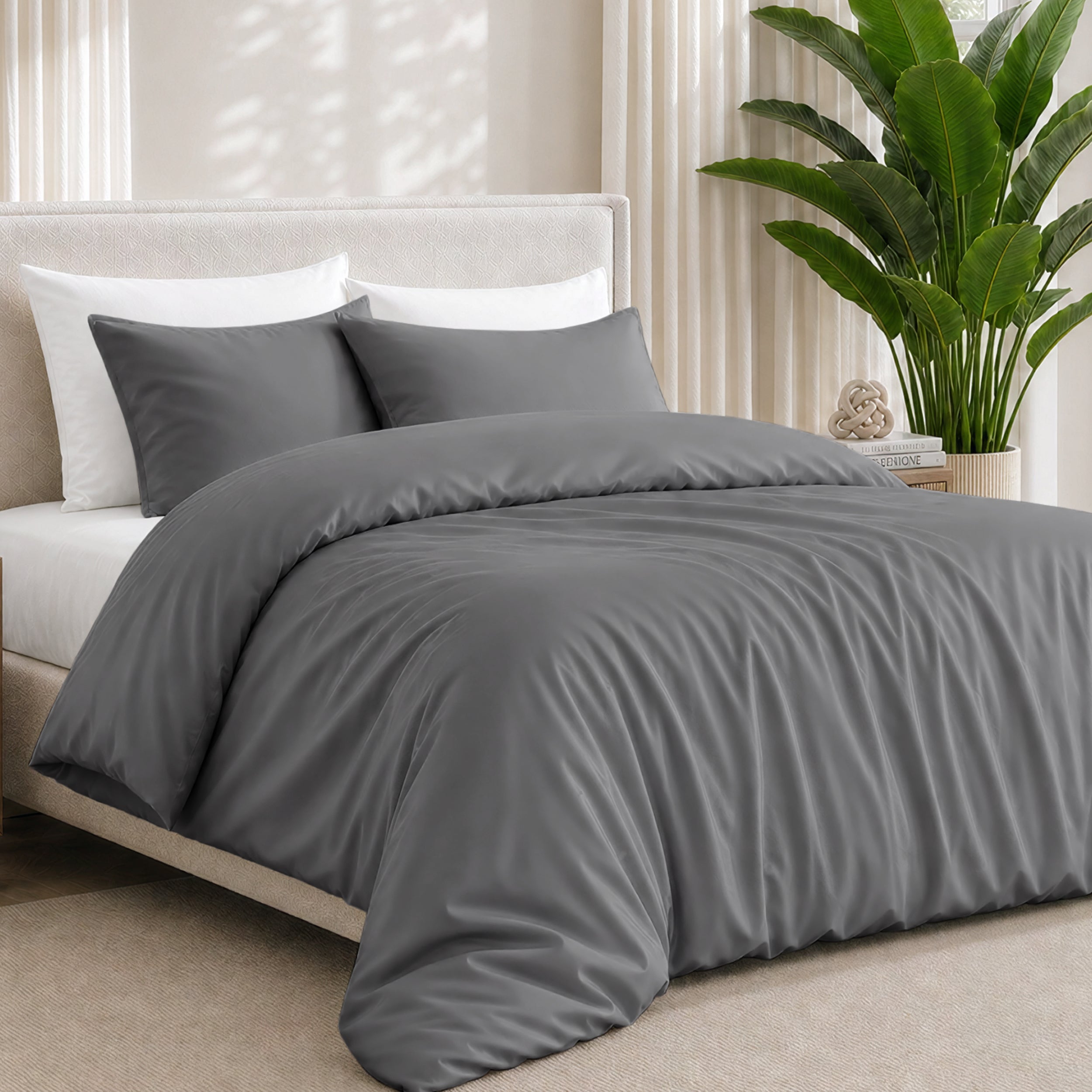 Bamboo bedding set on a bed in a bedroom with a plant in the corner.