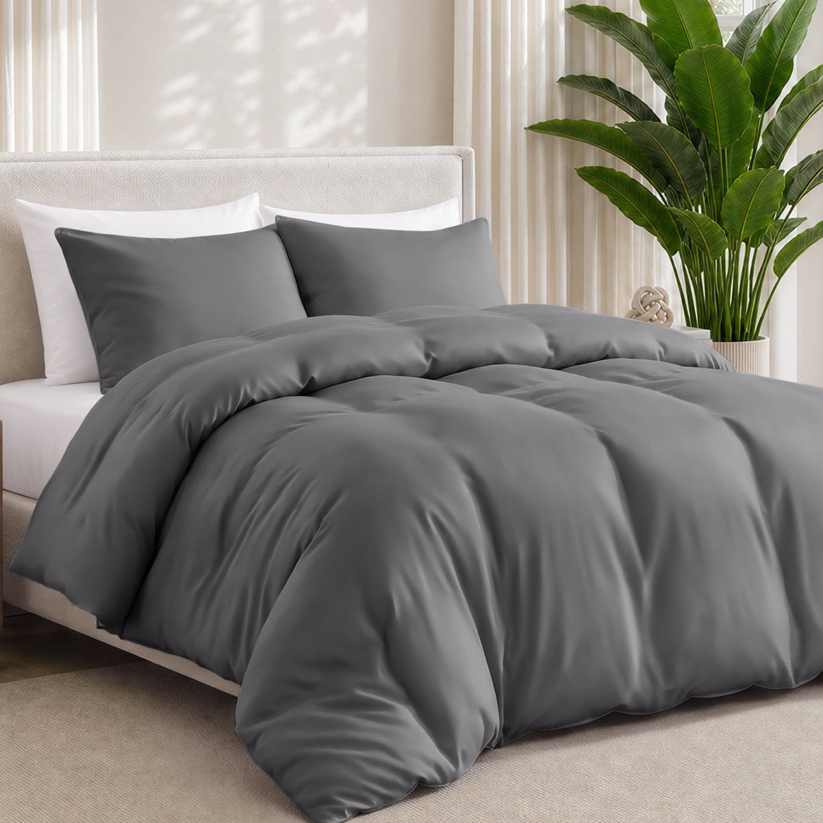Bamboo bedding set on a bed in a bedroom with a plant in the corner.