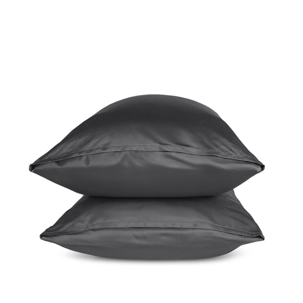 Two grey pillows stacked on a white background