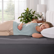 A woman sleeping on a bed