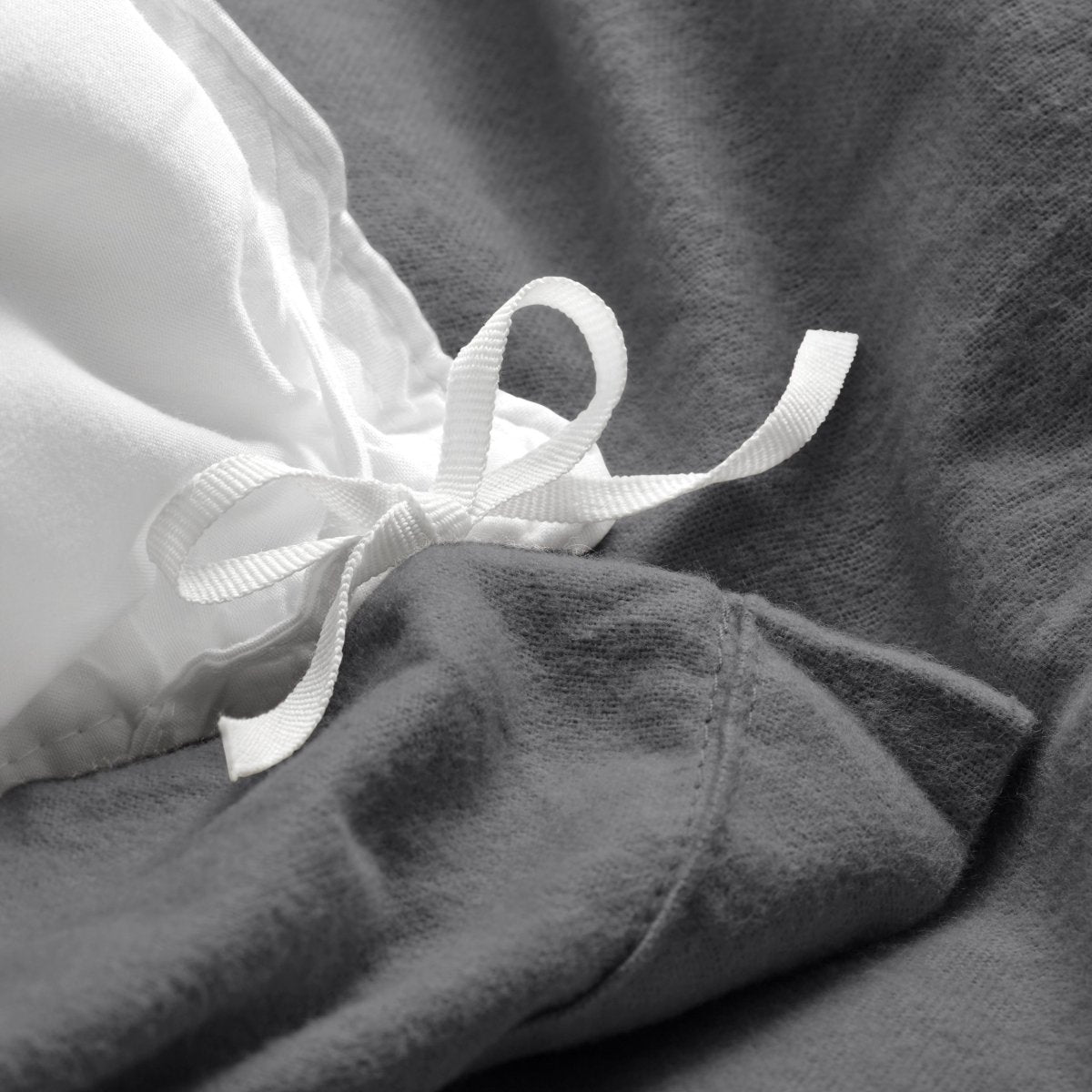 Close-up of the ties on a flannel duvet cover