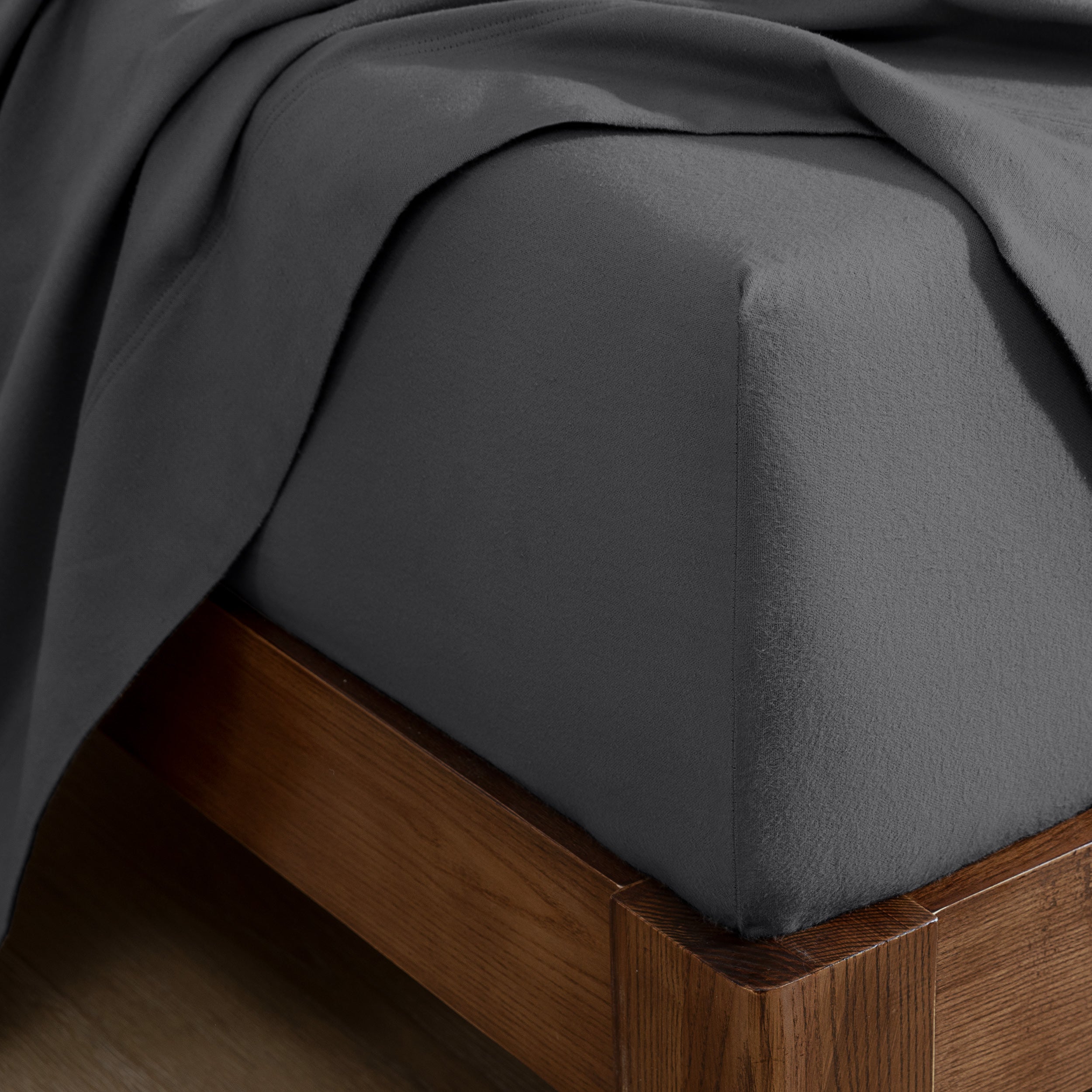 Flannel fitted sheet on a wooden bed frame