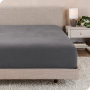 A close up of a modern bed with a flannel fitted sheet on