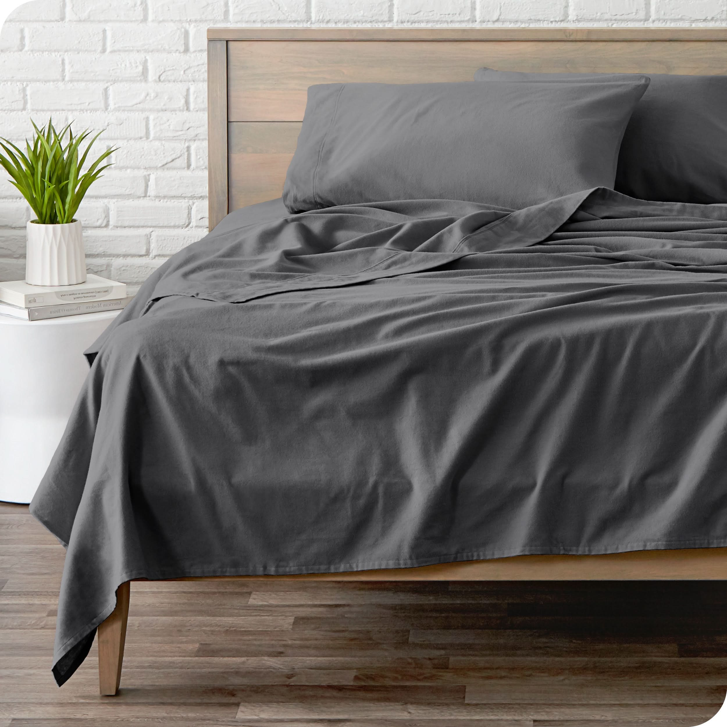 A modern bed with a flannel sheet set on