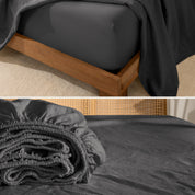 Fitted sheet on a wooden bed frame and folded fitted sheet.