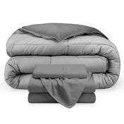 A reversible microfiber comforter and a coordinating sheet set folded and stacked