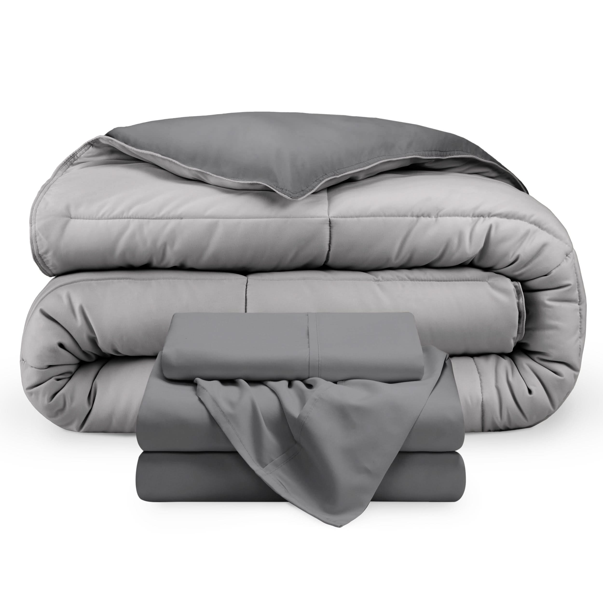 A reversible microfiber comforter and a coordinating sheet set folded and stacked