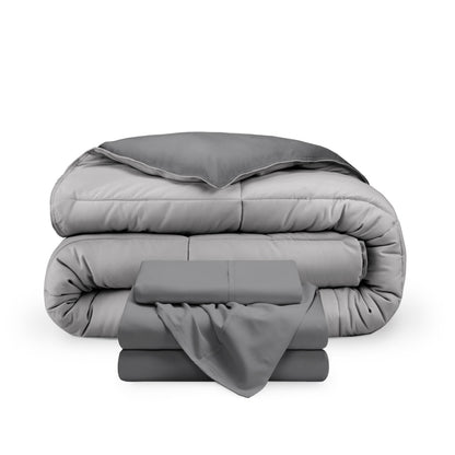A reversible microfiber comforter and a coordinating sheet set folded and stacked
