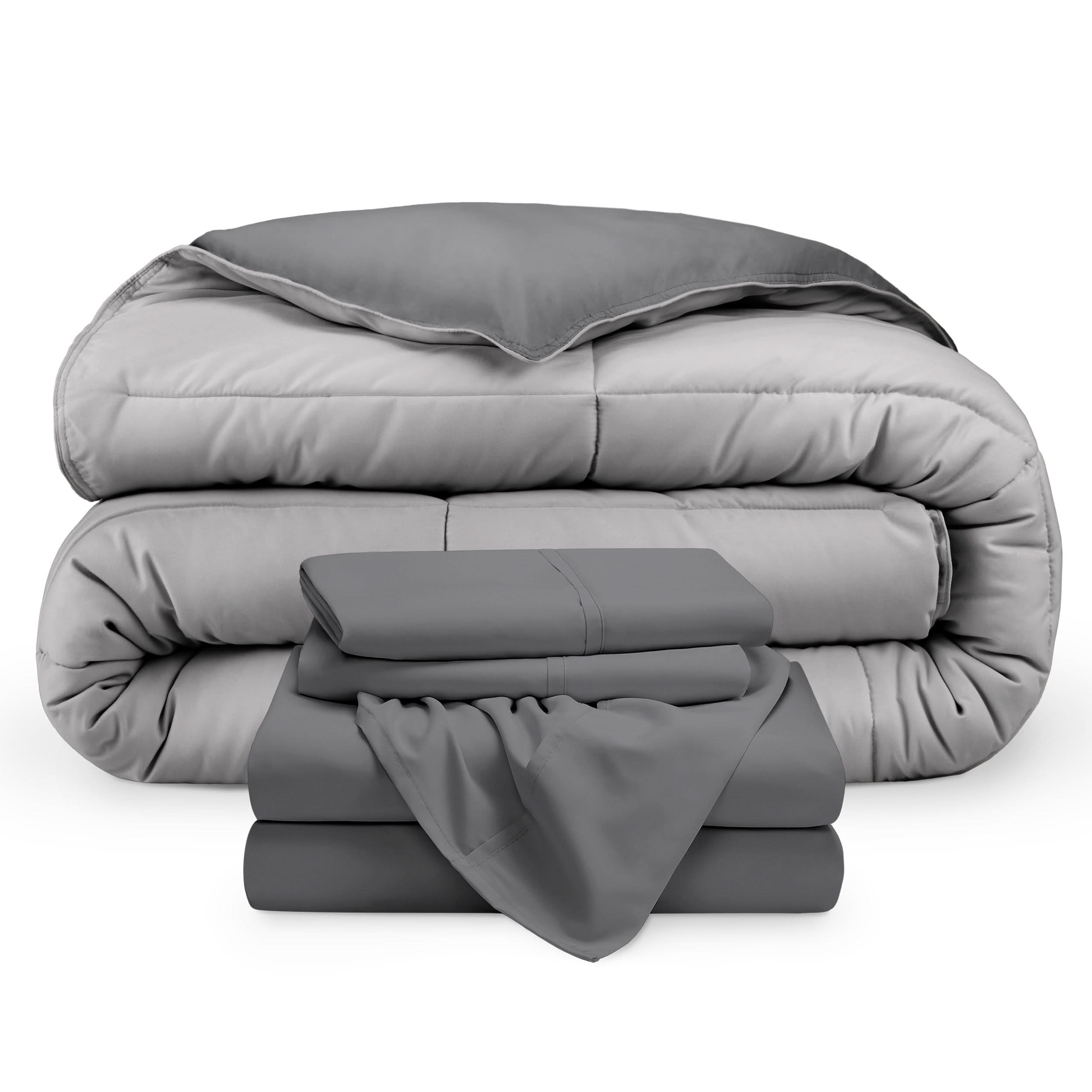 A reversible microfiber comforter and a coordinating sheet set folded and stacked