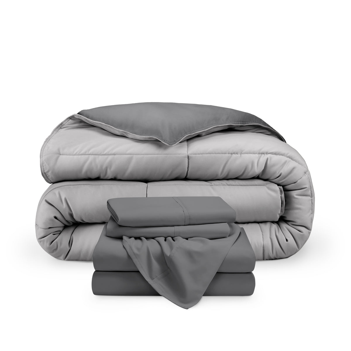 A reversible microfiber comforter and a coordinating sheet set folded and stacked