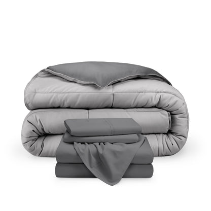A reversible microfiber comforter and a coordinating sheet set folded and stacked