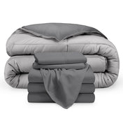 A reversible microfiber comforter and a coordinating sheet set folded and stacked