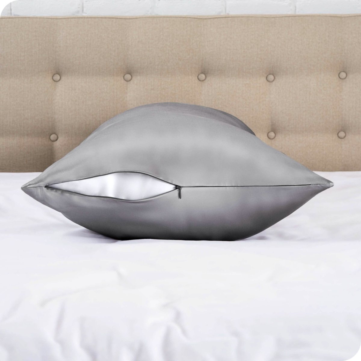 The zipper closure on a silk body pillowcase