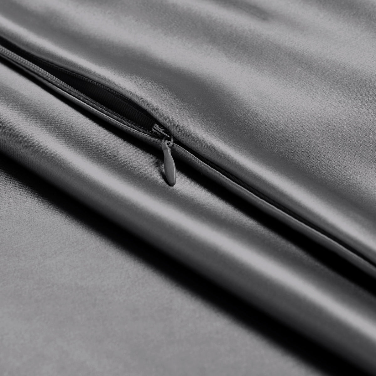 Close-up of a silk pillowcase with a zipper