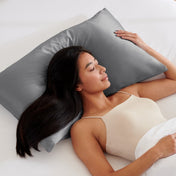 Woman lying on a grey pillow