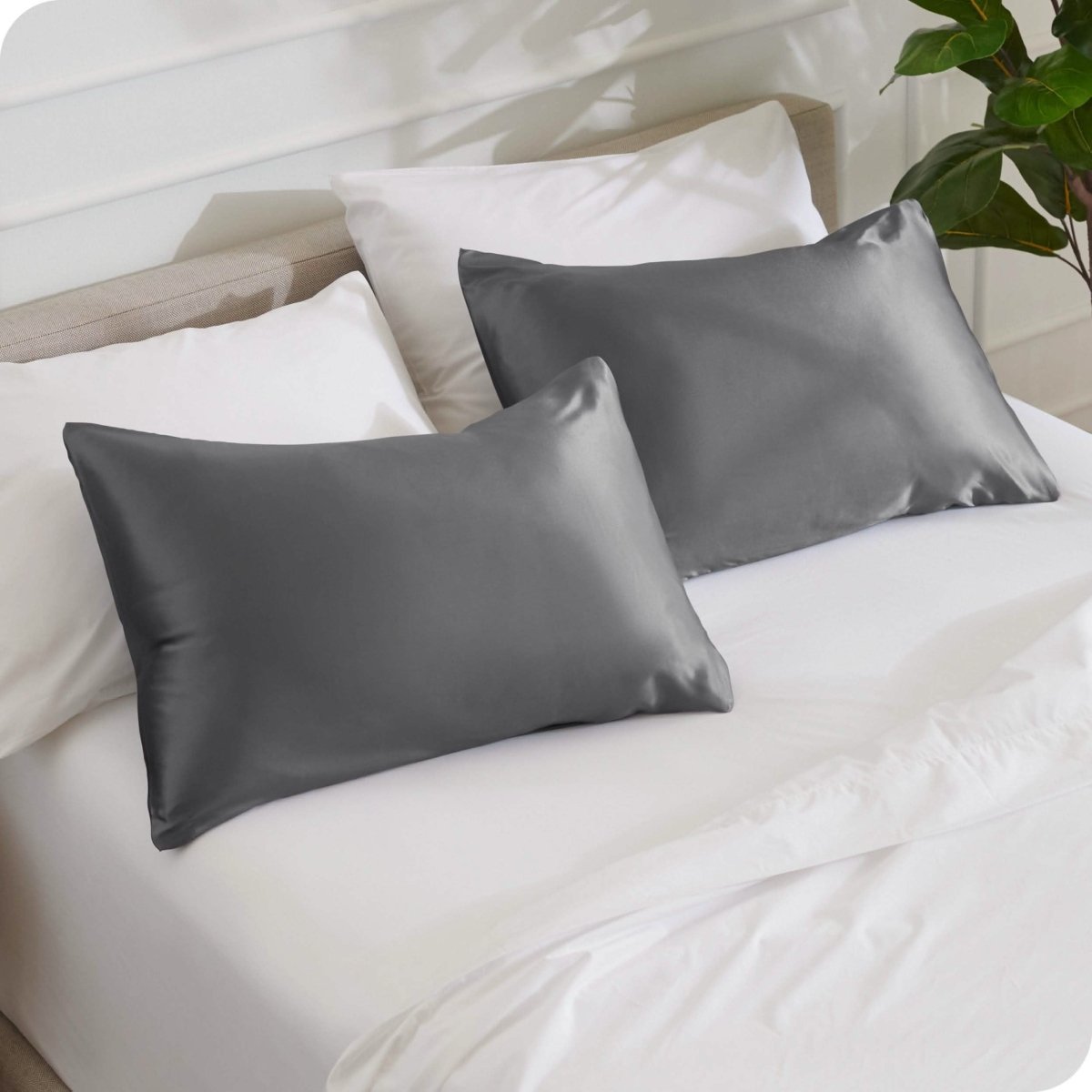 2 mulberry silk pillowcases on pillows set on a bed