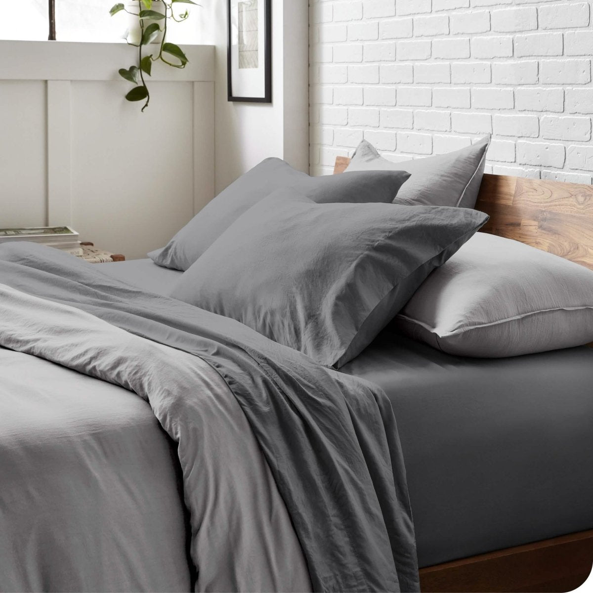 Modern bedroom with washed sheets and duvet cover on a bed