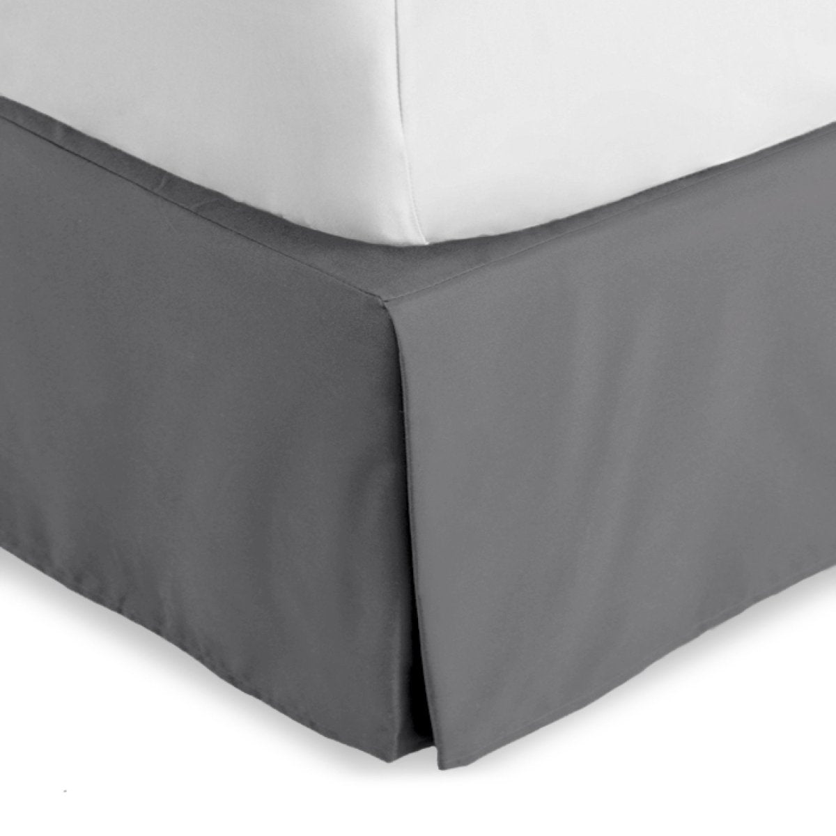 Bed skirt on a bed with white bedding