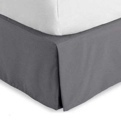 Bed skirt on a bed with white bedding