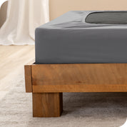 Close up of the corner of a bed frame with a cover box spring 