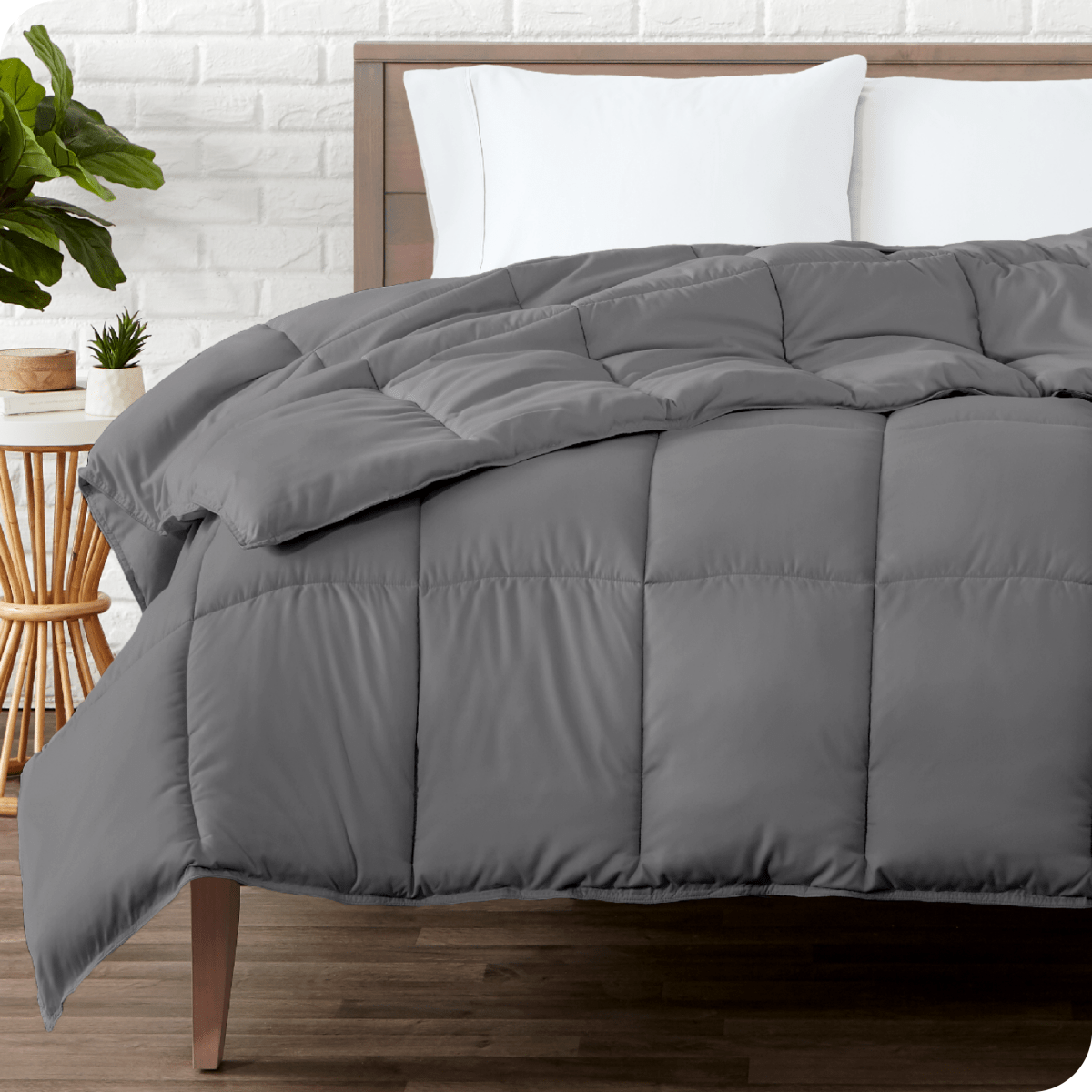 A modern bedroom with a duvet insert on a bed folded back over itself