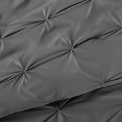 Close-up showing the pintuck detailing of the comforter set