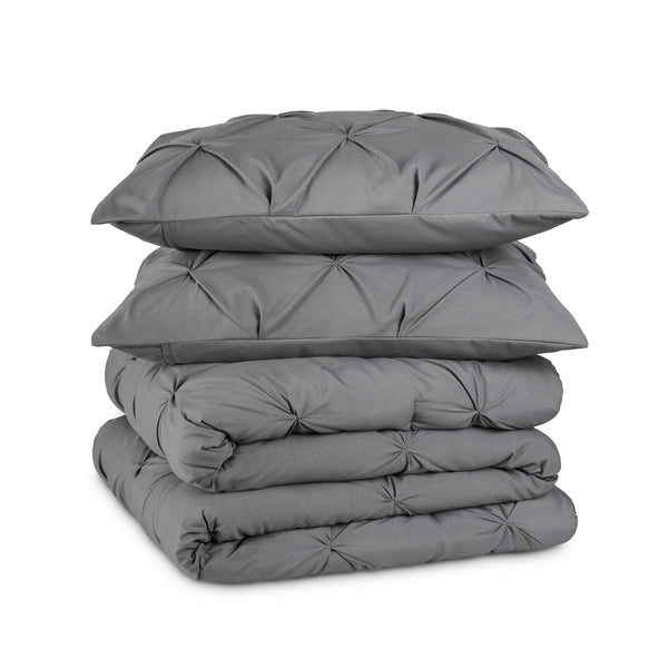 Gray pintuck comforter on a white background