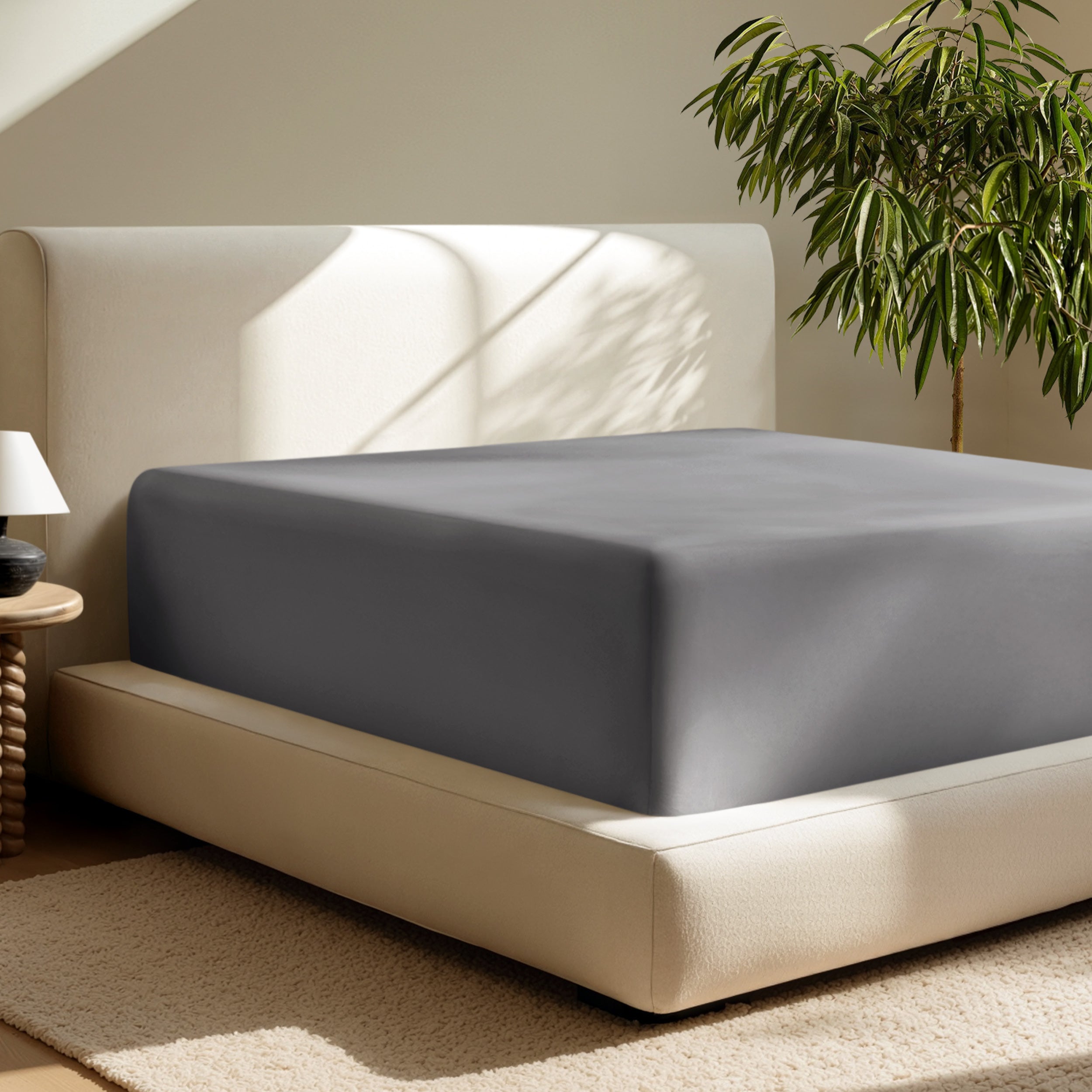 A deep pocket fitted sheet on a mattress